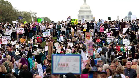 Protesters attend a "Hands Off" rally to demonstrate against U.S. President Donald Trump on the National Mall in Washington, DC