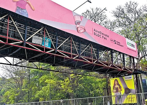 Hoardings, seen here on a skywalk, have become safety concern