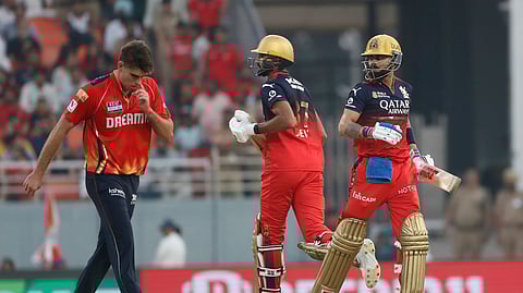 Royal Challengers Bengaluru's Virat Kohli and Devdutt Padikkal run between the wickets during the Indian Premier League cricket match between Punjab Kings and Royal Challengers Bengaluru at Maharaja Yadavindra Singh Cricket Stadium in Mohali, India, Sunday, April 20, 2025.
