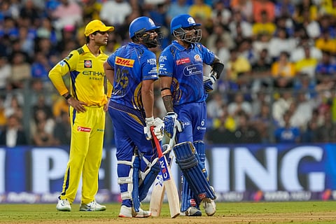 Suryakumar Yadav (left) and Rohit Sharma hit decisive half-centuries as Mumbai Indians won a third game on the spin to move up the table