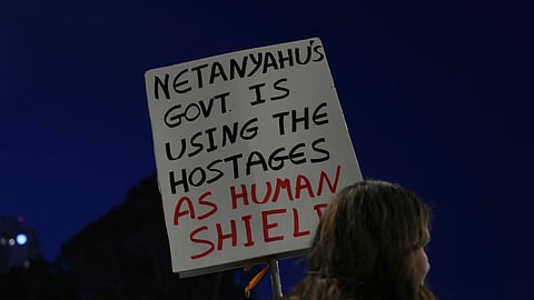 People take part in a protest demanding the immediate release of hostages held by Hamas in the Gaza Strip, in Tel Aviv, Israel, on Saturday, April 19, 2025.