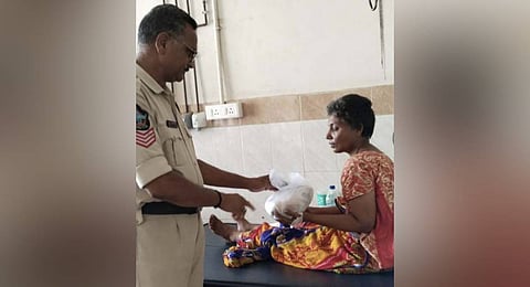 Rama Rao serving food to an orphan patient in a government hospital