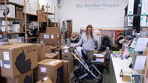 Elizabeth Mahon, owner of baby store Three Littles, unpacks strollers and other inventory ordered by customers ahead of tariff-driven price increases at her Union Market location in Washington, on Wednesday, April 16, 2025.