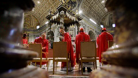 In this photo from April 12, 2005, cardinals attend a Mass celebrated by Brazilian Cardinal Eugenio Sales de Araujo at the Vatican's St. Peter's Basilica, ahead of the funeral for Pope John Paul II.