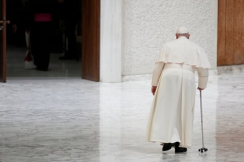 In this image from December 16, 2023, Pope Francis is seen leaving after a meeting with the performers of the living nativity scene of St. Mary Major, in the Pope Paul VI hall at the Vatican.