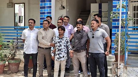 The accused, Sameer Nat, along with police officials.