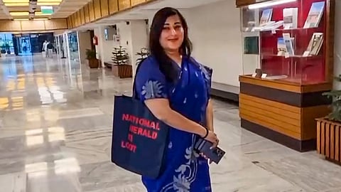 BJP MP Bansuri Swaraj carrying a bag with 'NATIONAL HERALD KI LOOT' printed on it, arrives to attend a JPC meeting on 'One Nation, One Election', New Delhi