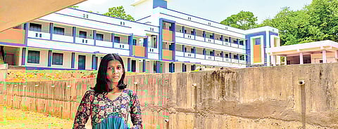 Sneha Kannan in front of the new school building