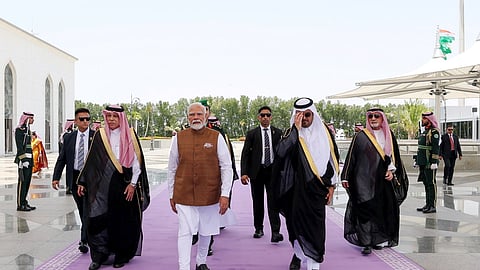 Prime Minister Narendra Modi being received by Deputy Governor of Makkah Prince Saud bin Mishaal bin Abdulaziz Al Saud and Saudi Arabia's Minister of Commerce Majid bin Abdullah Al Kassabi upon his arrival in Jeddah, Saudi Arabia, April 22, 2025.
