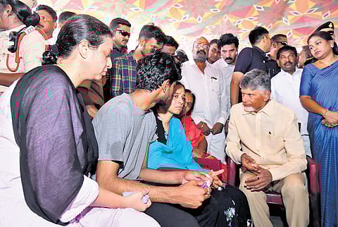 Chief Minister N Chandrababu Naidu consoles the family members of M Veeraiah Chowdary at Ammanabrolu in Prakasam district on Wednesday