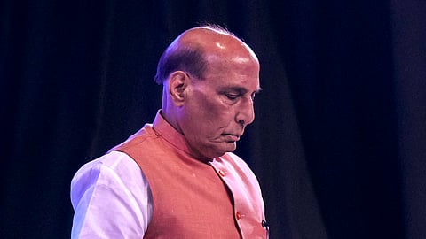 Defence Minister Rajnath Singh observes a moment of silence to pay respects to the victims of the Pahalgam terror attack, during a memorial lecture at Air Force Auditorium, New Delhi, Wednesday, April 23, 2025.