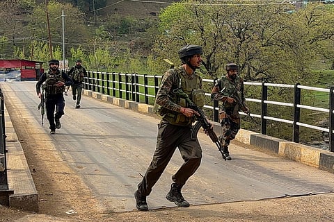 Security personnel rush to the spot after terrorists attacked a group of tourists at Pahalgam, in Anantnag district, Jammu & Kashmir, Tuesday, April 22, 2025.