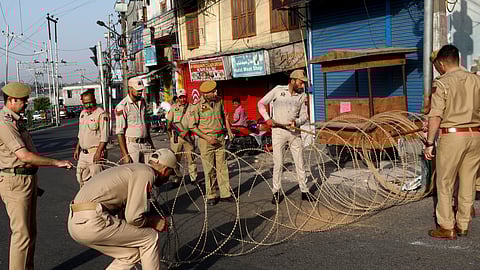 Police block a road with concertina wire as security has been beefed up in view of Pahalgam terrorist attack, in Jammu.