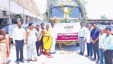 Adani cement factory representatives donate cement for Sri Rajarajeshwara Swamy temple in Vemulawada, Rajanna-Sircilla district on Thursday.