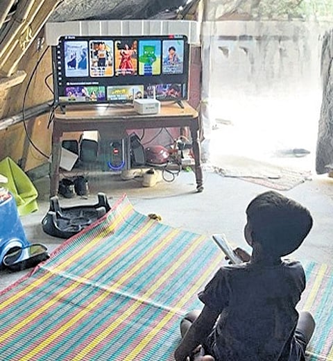 A kid browses YouTube on a TV in Hajipalle of Rangareddy district