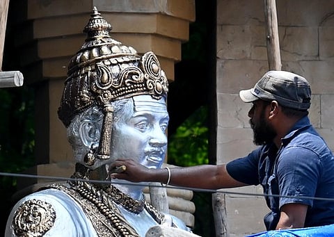 The statue of Basaveshwara being repainted ahead of Basava jayanti at Chalukya Circle in Bengaluru on Saturday.