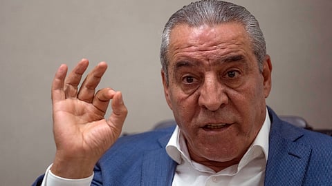 Hussein al-Sheikh, secretary-general of the Executive Committee of the Palestine Liberation Organization, gestures during an interview with The Associate Press at his office in the West Bank city of Ramallah, June 13, 2022.
