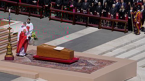 Dean of the College of Cardinals Giovanni Battista Re spreads incense around the coffin of Pope Francis during his funeral in St. Peter's Square at the Vatican, Saturday, April 26, 2025.