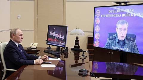Russian President Vladimir Putin listens to Russian Chief of General Staff Gen. Valery Gerasimov with the report that all Ukrainian troops have been forced from Russia's Kursk region, during their meeting via videoconference.