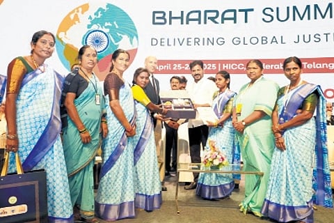 Members of the Indira Mahila Shakti present a memento to foreign delegates in the presence of Chief Minister A Revanth Reddy during the Bharat Summit 2025 at HICC in Hyderabad on Saturday