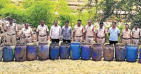 Excise department officials with seized material during raids at AOB