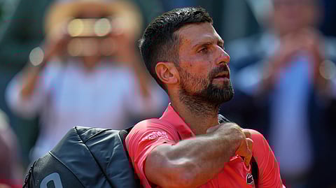 Novak Djokovic of Serbia leaves the court after losing against Matteo Arnaldi of Italy during the Madrid Open tennis tournament in Madrid, Spain, Saturday, April 26, 2025.
