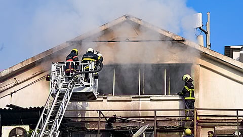Firefighters douse a fire which broke out at the ED office building in south Mumbai's Ballard Estate area, Sunday, April 27, 2025.