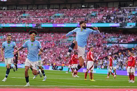 Manchester City's Josko Gvardiol, right, celebrates after scoring during the English FA Cup semifinal soccer match between Nottingham Forest and Manchester City at Wembley stadium in London, Sunday, April 27, 2025.