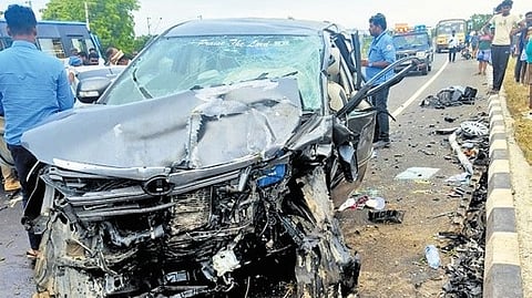 The mangled remains of the two cars involved in the collision on the Tirunelveli-Kanniyakumari National Highway at Thalapathisamuthiram on Sunday