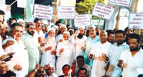 Muslim clerics and community members hold a candlelight vigil for the Pahalgam terror attack victims in Mysuru on Monday.