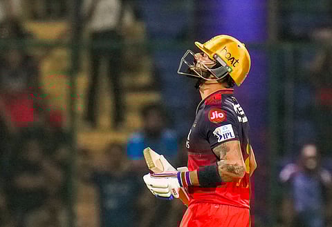RCB's Virat Kohli reacts after completing his half century during an IPL 2025 T20 cricket match between Delhi Capitals and Royal Challengers Bengaluru, at the Arun Jaitley Stadium, in New Delhi, Sunday, April 27, 2025.