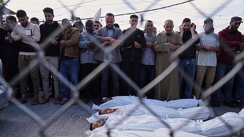 Palestinians mourn their relatives who were killed in an Israeli army airstrike on the Gaza Strip, at the morgue of Al-Aqsa Hospital in Deir al-Balah, Gaza, Sunday, April 27, 2025.