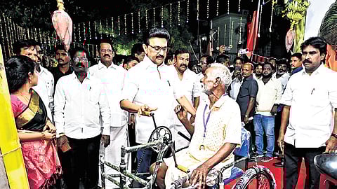 Stalin distributing welfare assistance to the public in Kolathur on Tuesday.