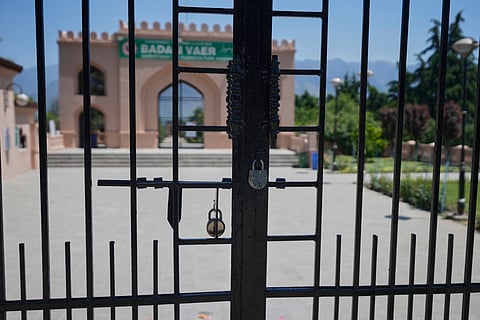 A locked garden gate is seen in Srinagar after it was closed by authorities as a precautionary safety measure following last week's deadly attack on tourists near the resort town of Pahalgam, in Kashmir, Tuesday, April 29, 2025.