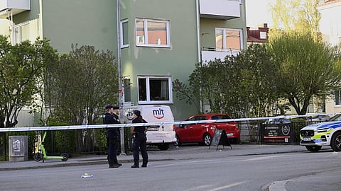 Police at the scene after a shooting incident, at Vaksala Square, in central Uppsala, Sweden, Tuesday, April 29, 2025.