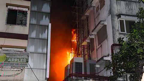 lames rise after a fire broke out at a hotel in Kolkata, Tuesday night, April 29, 2025.