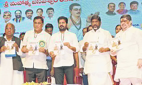 Chief Minister A Revanth Reddy unveils Basaveshwara Krupa book during the Mahatma Basaveshwara Jayanthi celebrations in Hyderabad on Wednesday