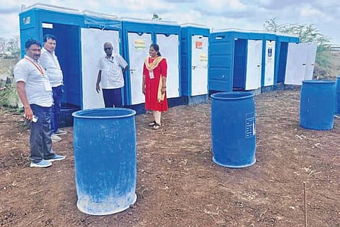 GMC officials oversee sanitation works at Amaravati event venue.