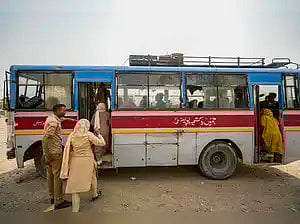 Pakistani nationals crossing over to their home country aboard a bus at Attari border in Amritsar on Wednesday