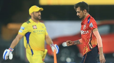 Punjab Kings' Yuzvendra Chahal, right, celebrates the dismissal of Chennai Super Kings' Mahendra Singh Dhoni , left, during the Indian Premier League cricket match between Chennai Super Kings and Punjab Kings' at M. A. Chidambaram Stadium in Chennai, India, Wednesday, April 30, 2025.