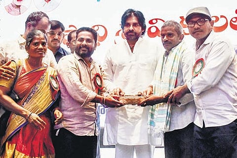 Deputy CM Pawan Kalyan with MGNREGA workers during an event organised in Mangalgiri to mark May Day I Prasant Madugula