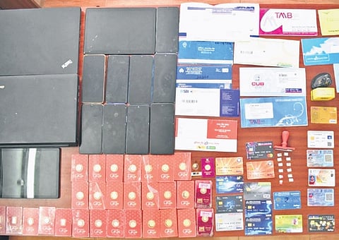 Nine mobiles, two laptops, 30 gold coins and 10 debit cards were seized