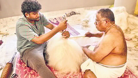 C Muraleedharan and nephew Akhilesh making the venchamaram for Paramekkavu devaswom’s kudamattam for Thrissur Pooram