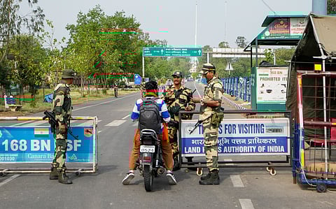 Security personnel stop a commuter at an Integrated Check-Post, near the Attari-Wagah border, in Amritsar district, Friday, May 2, 2025.