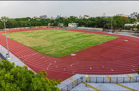 Madras High Court has temporarily stayed the award of tender and work order issuance by the police department to a private firm for laying synthetic tracks.