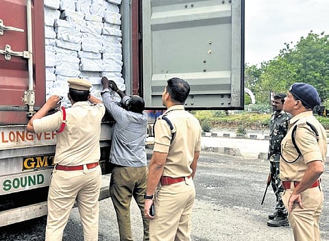 Police check vehicles at Telangana-AP border in Wadapally on Saturday