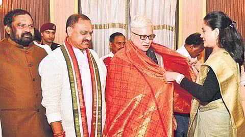TPCC president Mahesh Kumar Goud looks on as Congress MLC Vijayashanti presents a shawl to Governor Jishnu Dev Varma at Raj Bhavan in Hyderabad on Friday