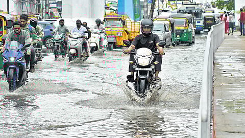 A waterlogged road after sudden downpour at PNBS in Vijayawada on Sunday.