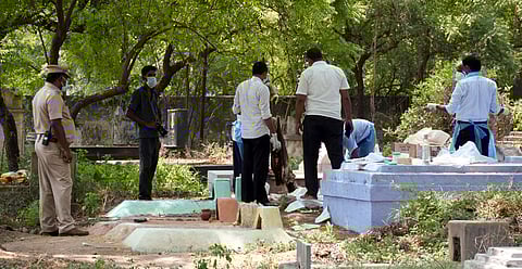 Police and medical team exhumed the body of Sigamani, a tour operator from Dubai for Post-mortem at Balammalpuram graveyard in Karur on Saturday:
