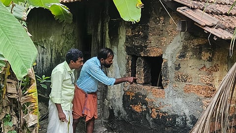 Local residents show the kitchen of the vintage Ravi Pappan’s shop from where the copper pot was stolen